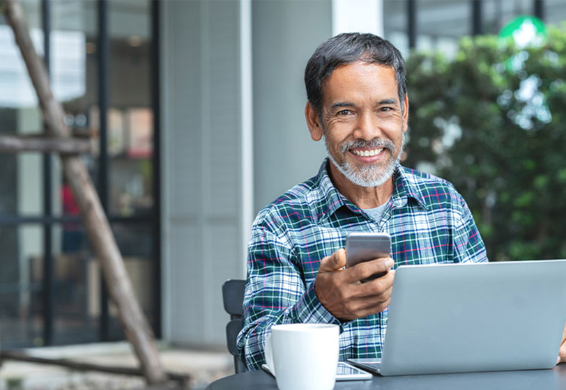 man scheduling a dental appointment at Hopewell Family Dentistry