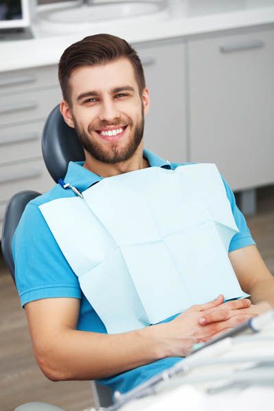 man smiling during his visit to Hopewell Family Dentistry